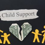 paper family with broken money heart and Child Support text