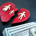 Broken heart with family and cash. Alimony concept.