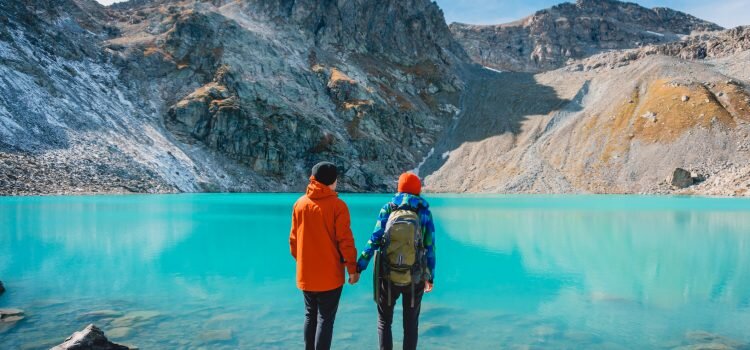 Couple of tourists looks at the lake
