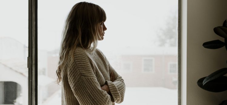 Sad woman staring out the window